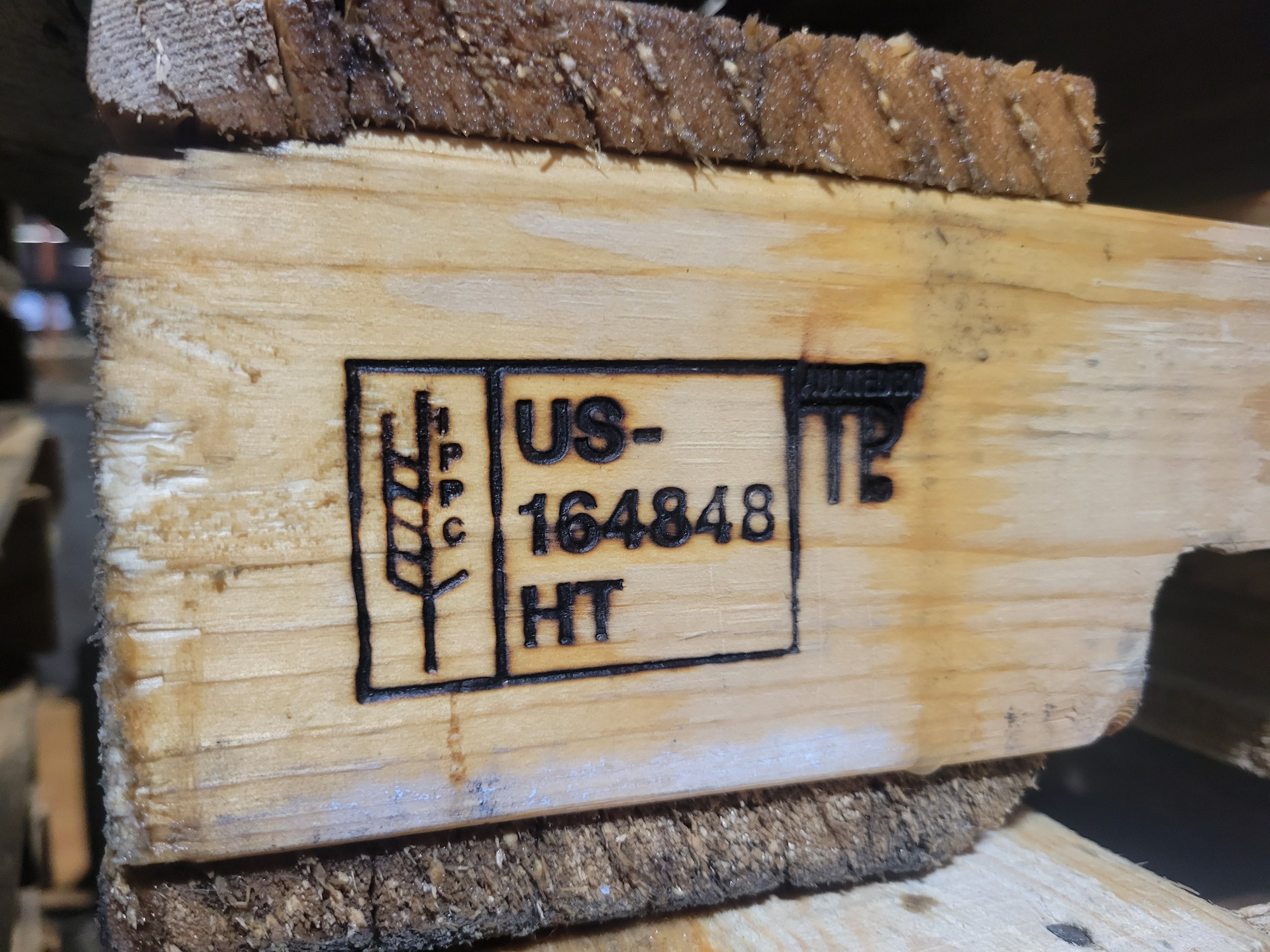 Heat-treated pallet brand mark